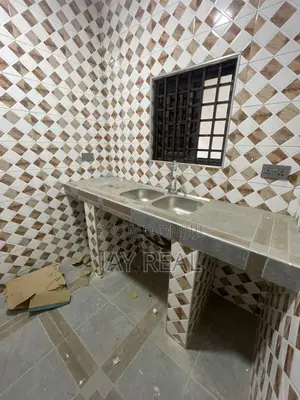 Road Side Plot With a Single Room Structure.