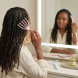 LOCS COMB. A 5-Claw Hand-Held Tool With Metal Beads Fitted at the Tips