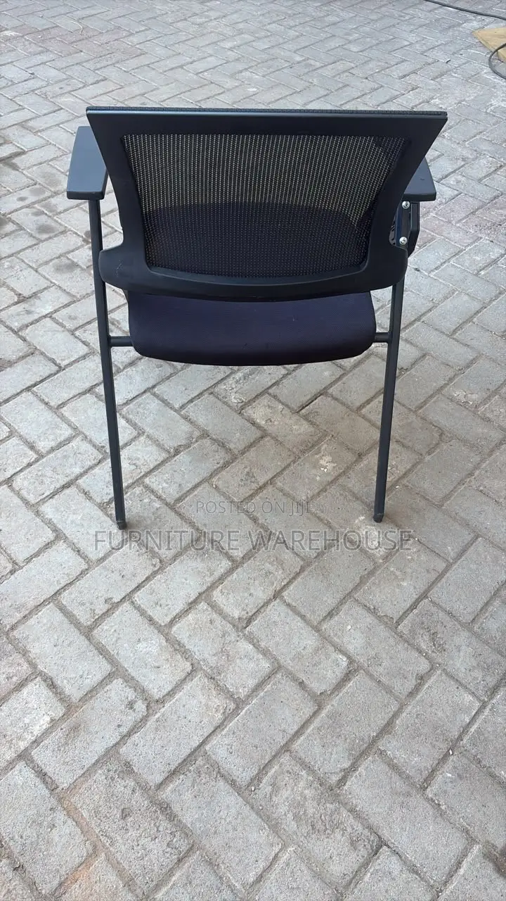 Ergonomic Mesh Training Chair With Foldable Writing Tablet Arm.