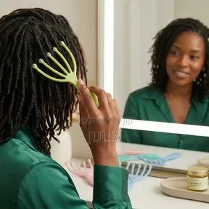 LOCS COMB. A 5-Claw Hand-Held Tool With Metal Beads Fitted at the Tips
