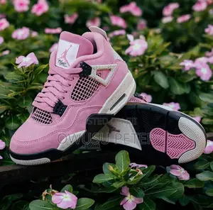 Pink Jordan 4 Retro Sneakers