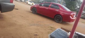 Toyota Corolla Base 4dr Sedan (1.8L 4cyl 5M) 2010 Red