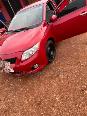 Toyota Corolla Base 4dr Sedan (1.8L 4cyl 5M) 2010 Red