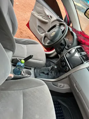 Toyota Corolla Base 4dr Sedan (1.8L 4cyl 5M) 2010 Red