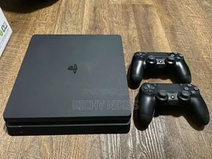 PS4 Slim 1TB With 2 Controllers & 8 Games " Jail Broken"