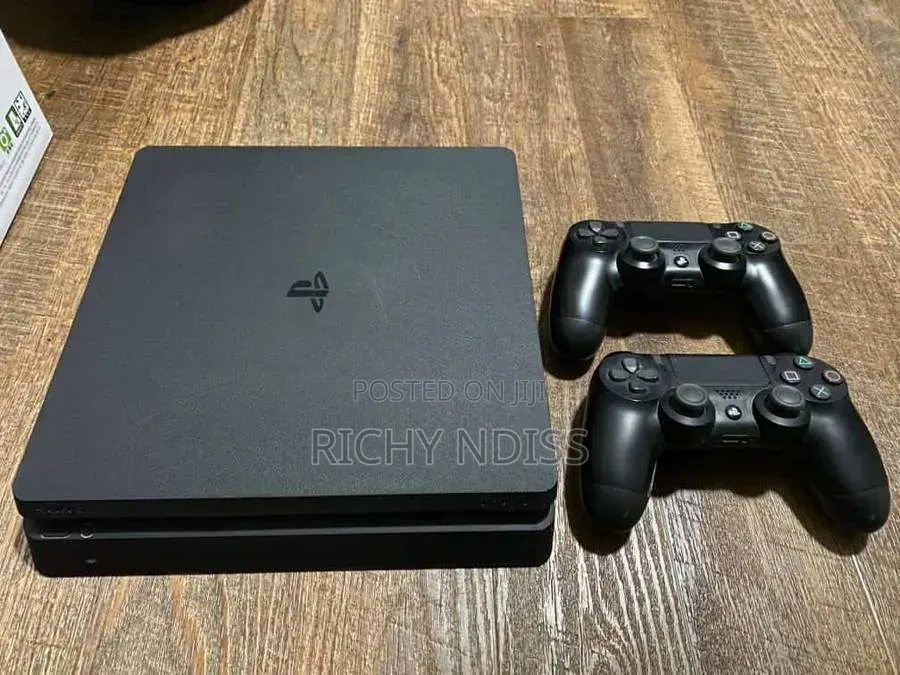 PS4 Slim 1TB With 2 Controllers & 8 Games " Jail Broken"