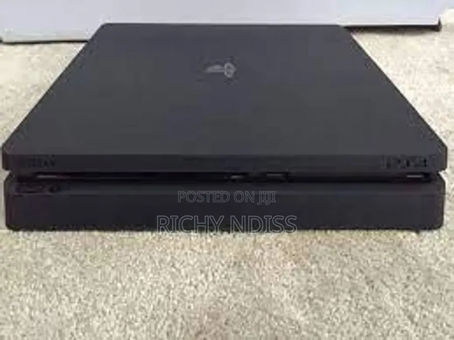 PS4 Slim 1TB With 2 Controllers & 8 Games " Jail Broken"