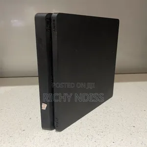 PS4 Slim 1TB With 2 Controllers & 8 Games " Jail Broken"