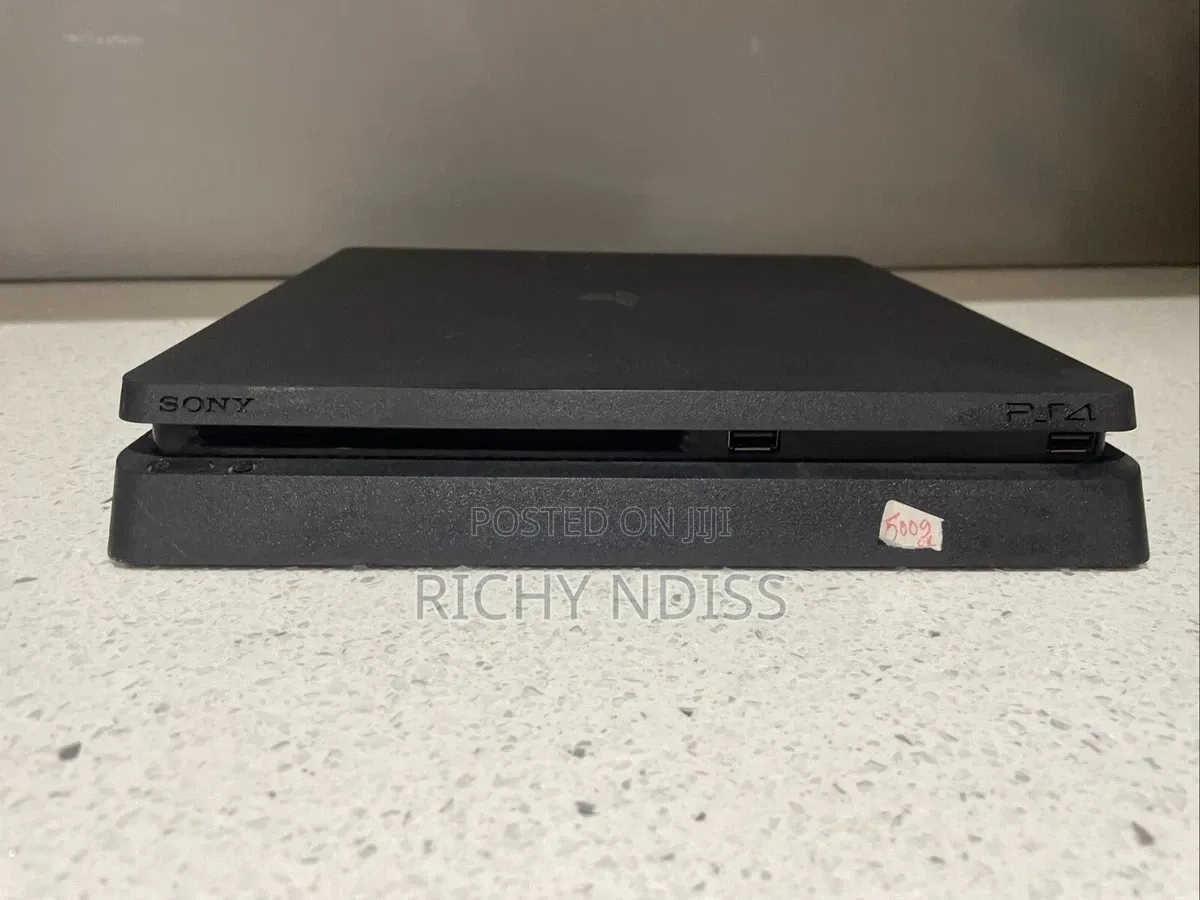 PS4 Slim 1TB With 2 Controllers & 8 Games " Jail Broken"