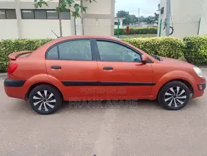 Kia Rio SX 4dr Sedan (1.6L 4cyl 4A) 2010 Orange