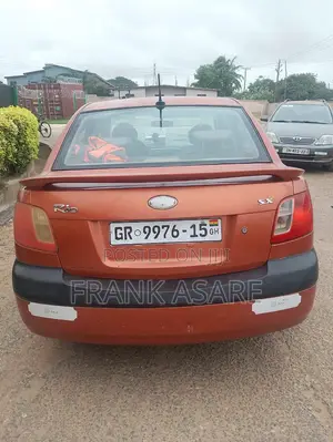 Kia Rio SX 4dr Sedan (1.6L 4cyl 4A) 2010 Orange
