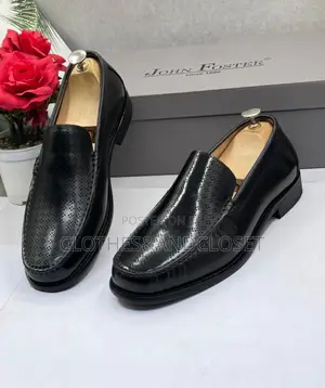 Black Leather Slip-on Dress Loafers Feature a Textured, and a Low Heel