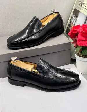 Black Leather Slip-on Dress Loafers Feature a Textured, and a Low Heel