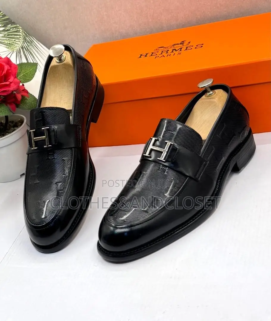 Black Leather Hermès Paris Men's Loafers Featuring a Signature Metalli