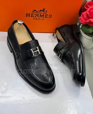 Black Leather Hermès Paris Men's Loafers Featuring a Signature Metalli