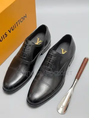 Black Leather Cap-Toe Lace-Up Oxfords Featuring Subtle Branding .