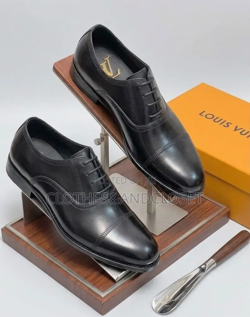 Black Leather Cap-Toe Lace-Up Oxfords Featuring Subtle Branding .