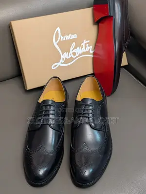 A Pair of Black Leather Wingtip Brogue Dress Shoes