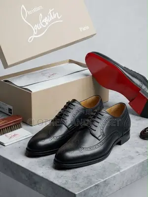 A Pair of Black Leather Wingtip Brogue Dress Shoes