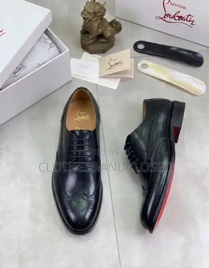 A Pair of Black Leather Wingtip Brogue Dress Shoes