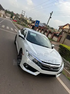 Honda Civic Touring 2dr Coupe (1.5L 4cyl) 2017 Pearl