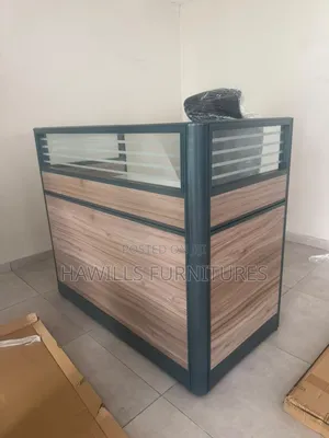 Receptionist Front Desk With a Wood Panel Finish.