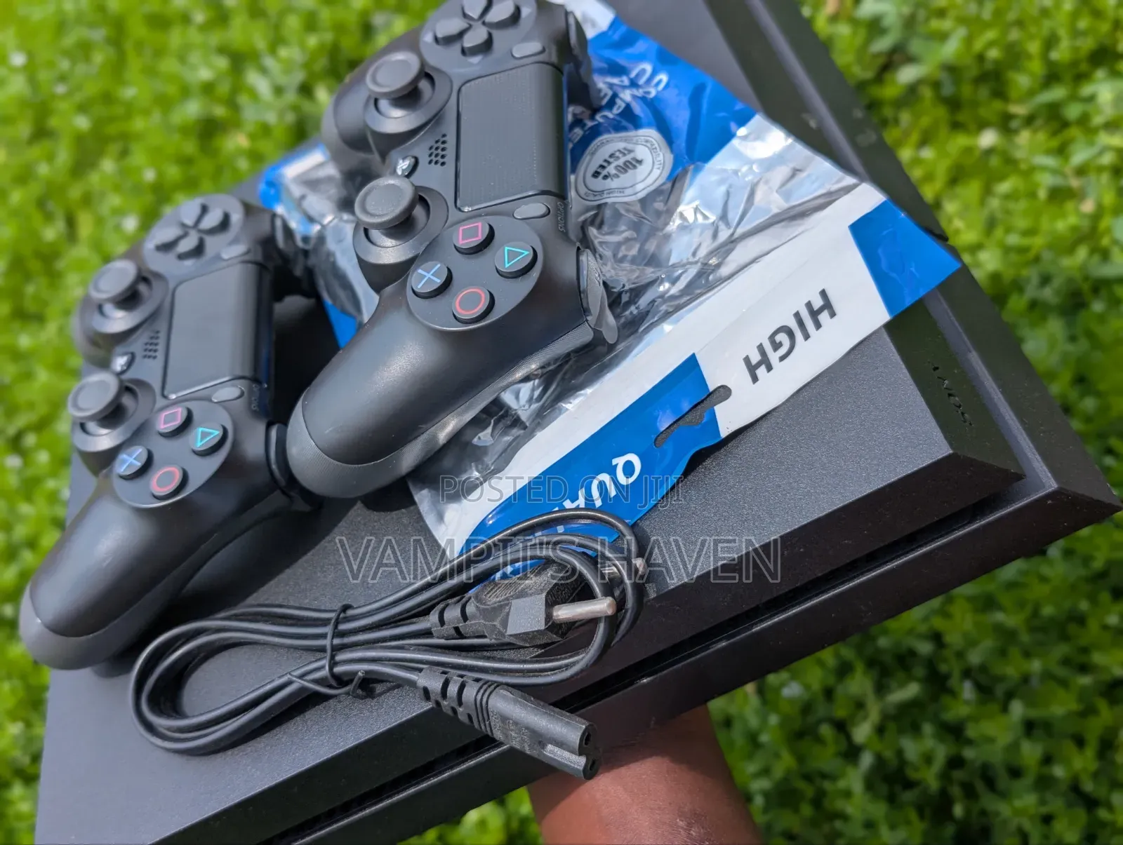 PS4 With 2 Controllers and 8 Games (FC27 and Others)