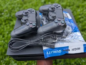 PS4 SLIM With 2 Controllers and 7 Games Including FC27