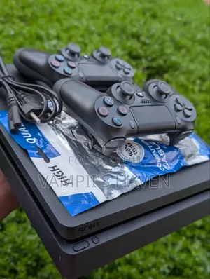 PS4 SLIM With 2 Controllers and 7 Games Including FC27