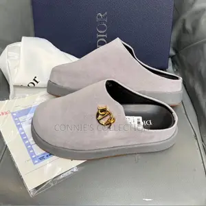 Dior Mules With a Gold-Toned