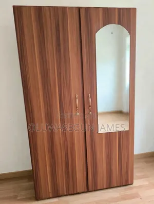 Neatly Used 2-Door Wooden Wardrobe With Mirror and Drawers - Takoradi