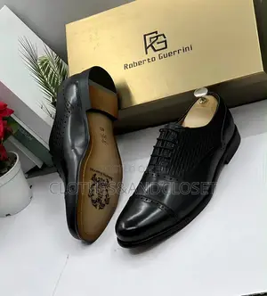 Cap-Toe Front With Subtle Brogue and a Textured/Woven-Style Pattern