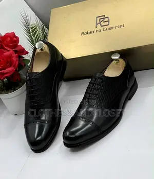 Cap-Toe Front With Subtle Brogue and a Textured/Woven-Style Pattern