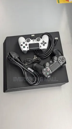 Sony PlayStation 4 Standard Console Loaded With Games + 2 Controllers