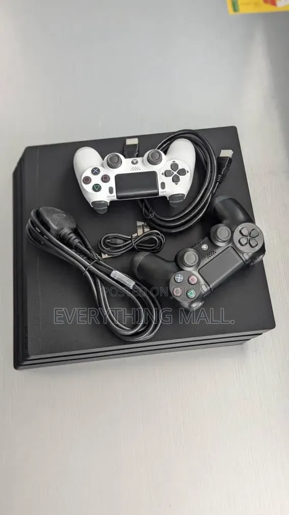 Sony PlayStation 4 Standard Console Loaded With Games + 2 Controllers