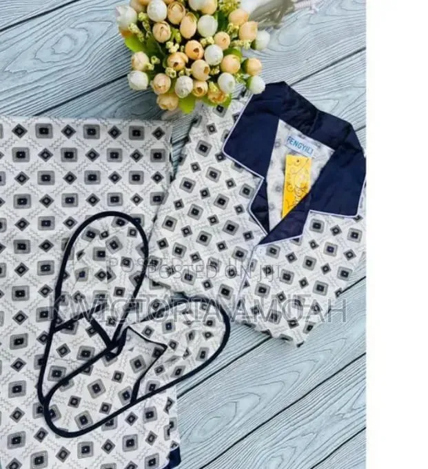 A Pyjamas Top Down With Attached Bedroom Slippers Set.