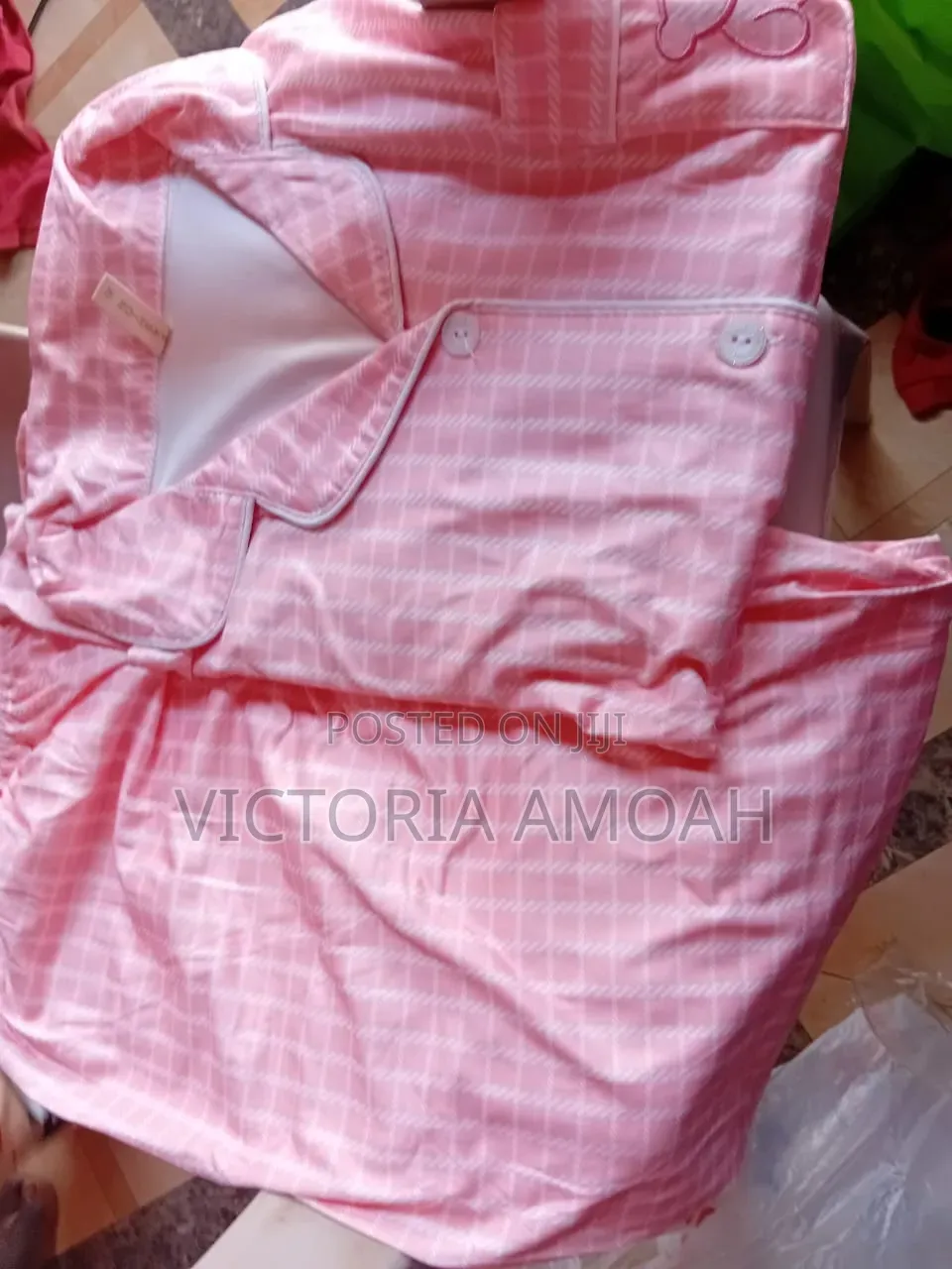 A Pink and White Striped Button-Down Pajama Set.