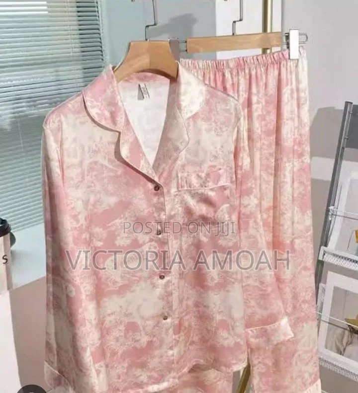 A Pink and White Printed Long- Sleeve Button- Down Pajama Set.