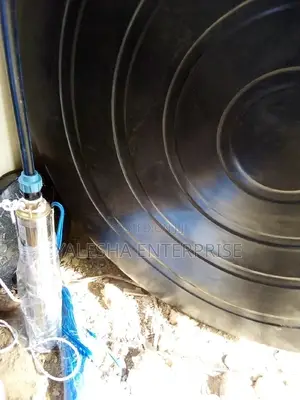 Borehole Drilling Services With Quality Pump and Blue Pipes
